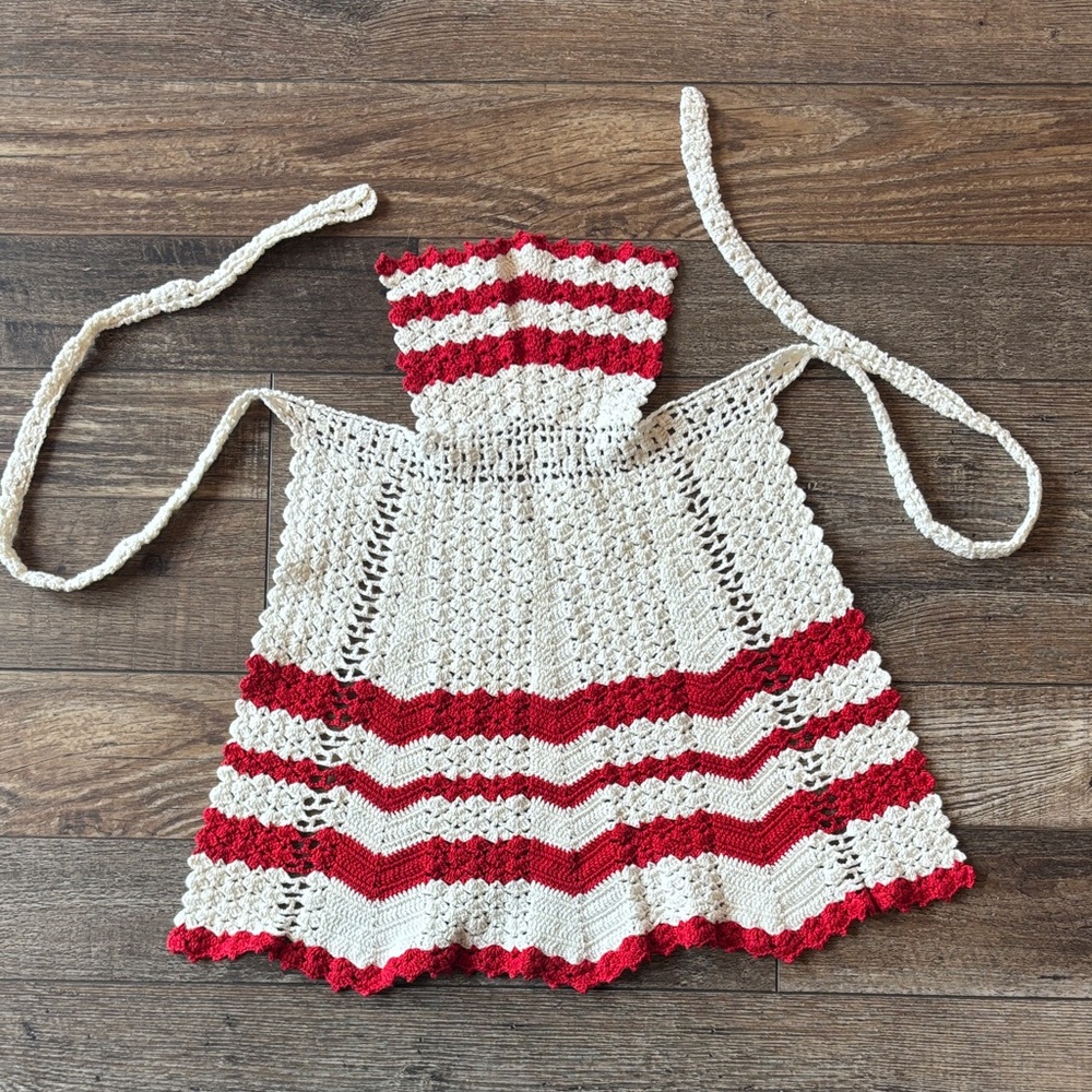 Red and White Crochet Pin on Apron